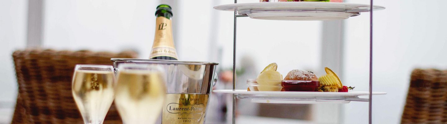 Close up image of afternoon tea with champagne.