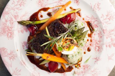 Full plate of colourful food from above.