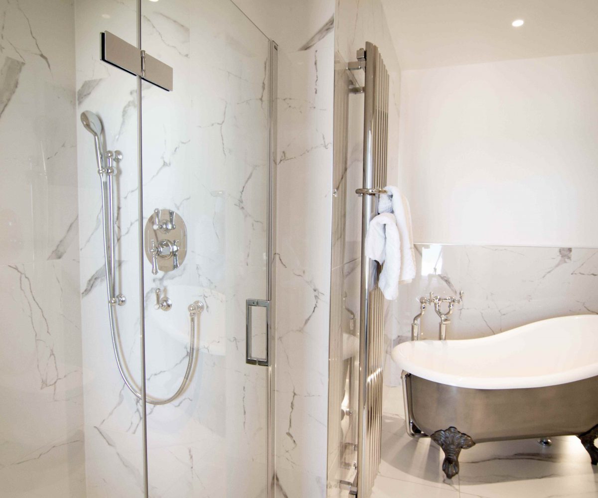 Large bathroom with clawfoot bathtub.