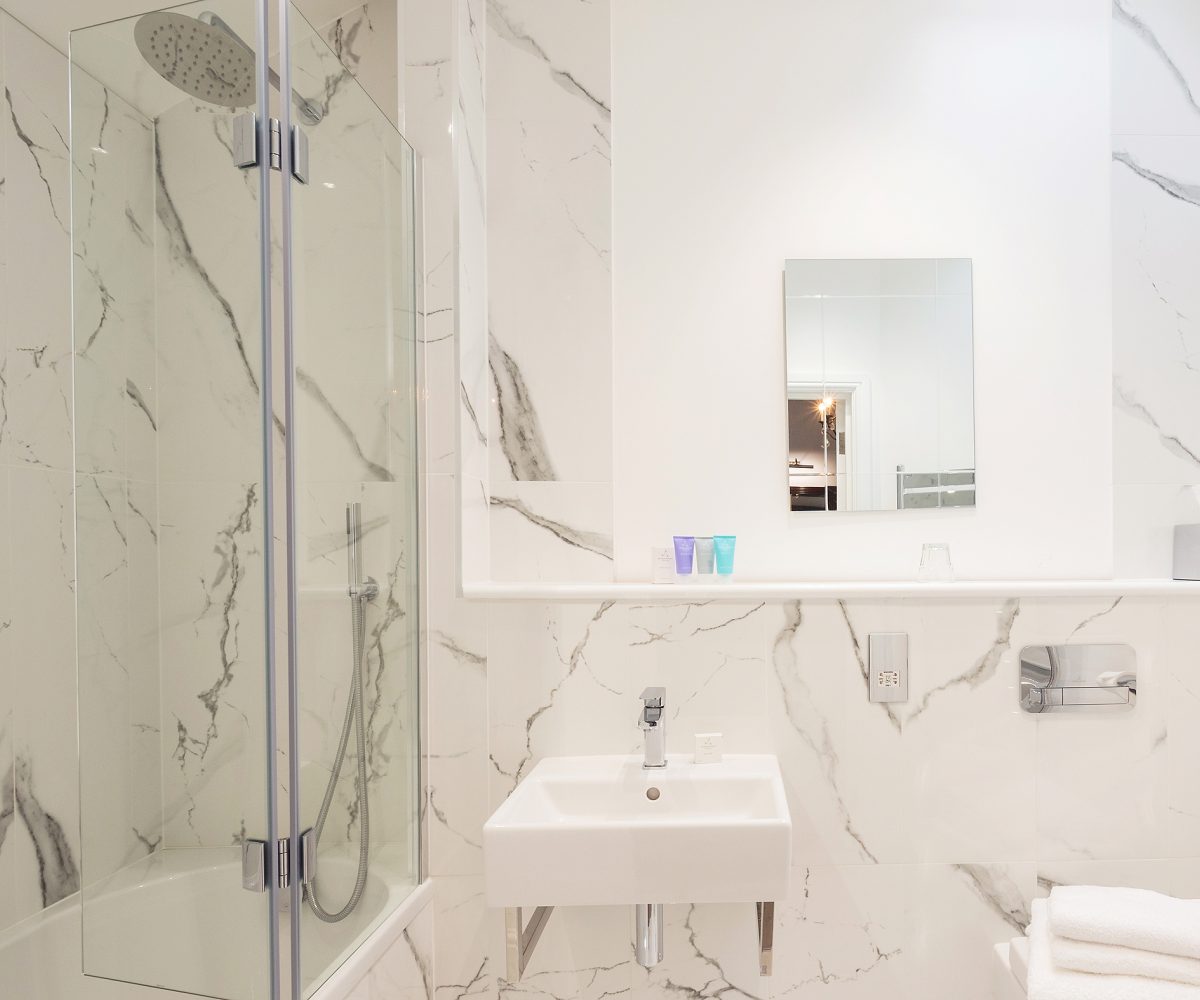 White bathroom with marbling effect.